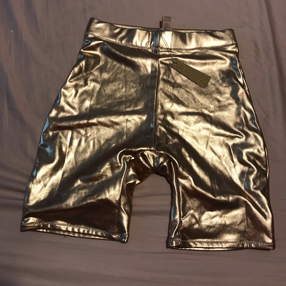 Skims size XS metallic gold swim shorts.
